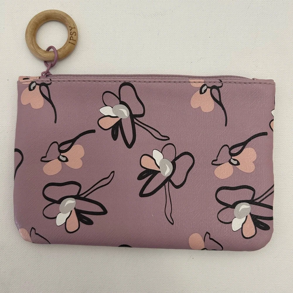Ipsy Glam Bag featuring a lavender floral print & signature wooden zipper pull